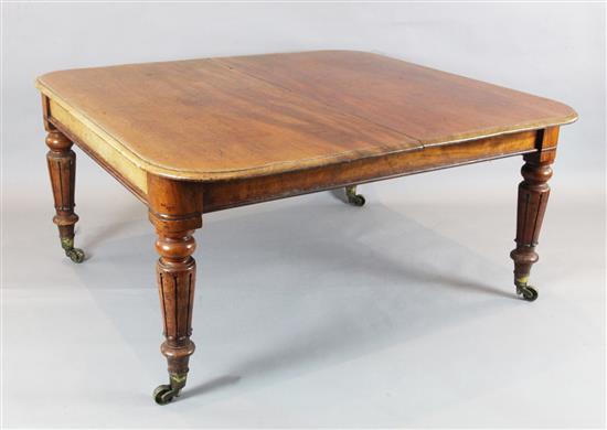 A Victorian mahogany extending dining table, with leaf holder and crank handle